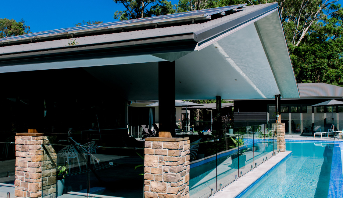 L - shape lap pool design backing onto gold coast home