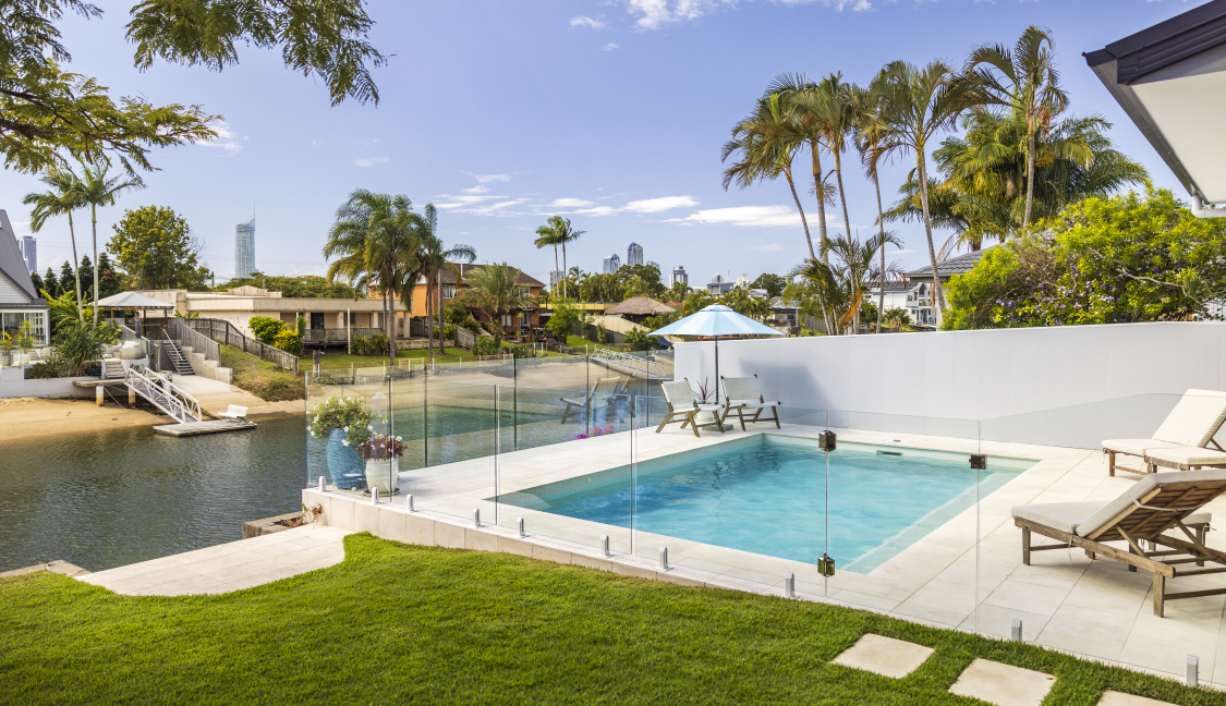 Family swimming pool in backyard along river on the Gold Coast