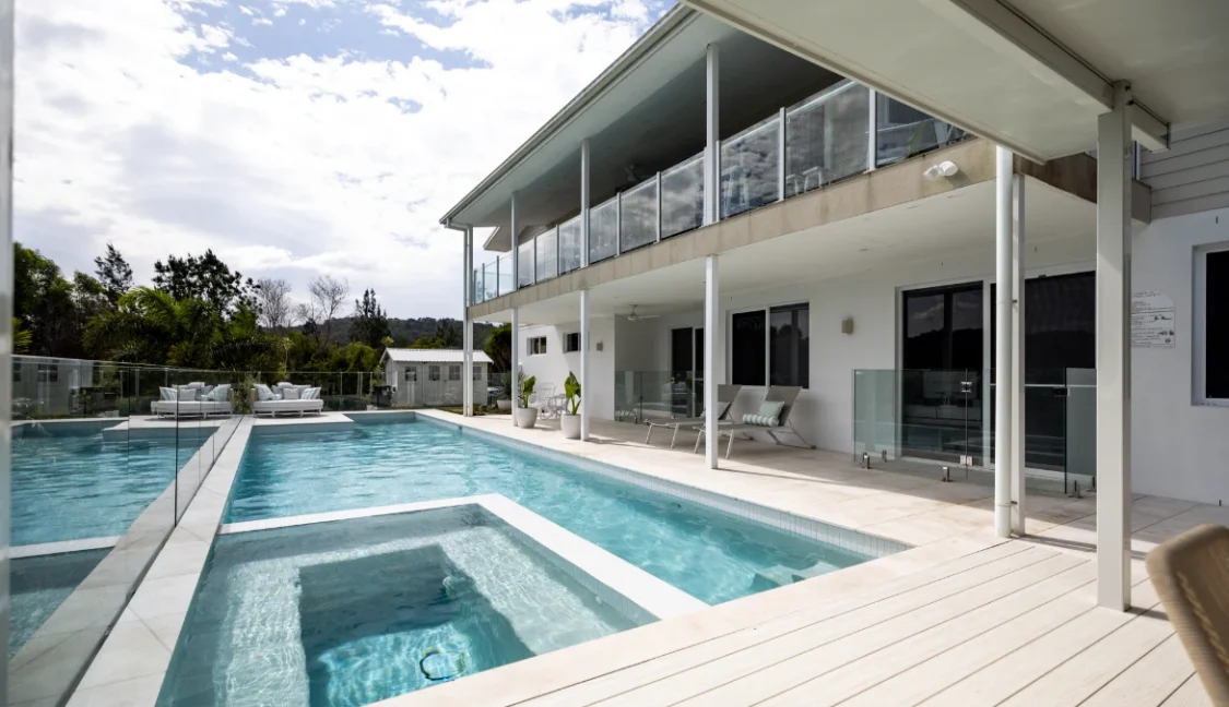 Geometric pool design by Aqua Living Pools with built in spa