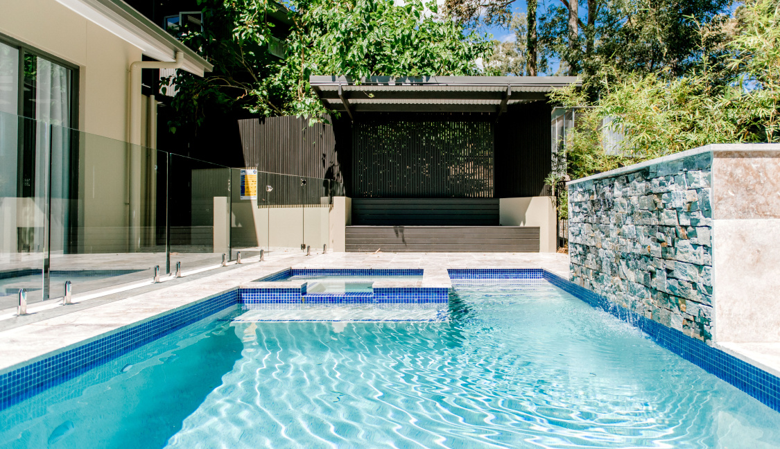 Concrete geometric family swimming pool built by Aqua Living Pools